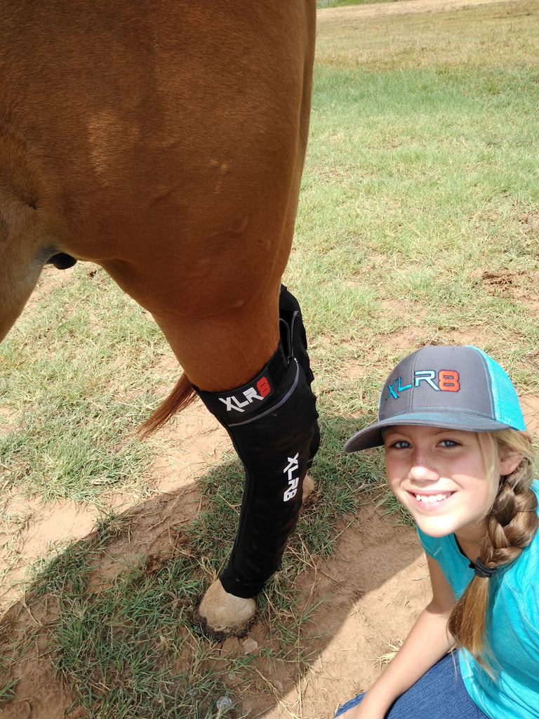 Young girl shows how easy it is to ice horse's legs with XLR8 Equine Cryo Boots. 